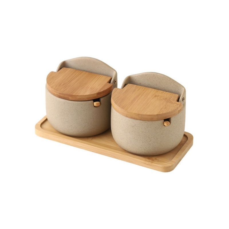 https://dilashome.com/cdn/shop/products/serene-porcelain-spice-jar-sugar-salt-condiment-pot-container-with-bamboo-lid-wooden-spoon-tray-2@2x.jpg?v=1633676170